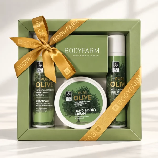 Coffret cadeau bien-être Pure Olive Bodyfarm avec gel douche, shampoing et crème mains et corps dans une boîte verte au ruban doré.