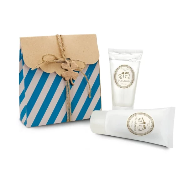 Duo cadeau soins des mains lait et miel avec savon et crème de 50 ml dans un sachet à rayures.