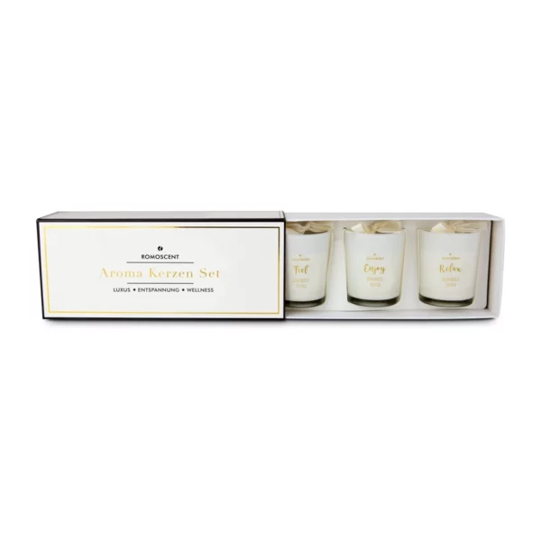 Coffret ROMOSCENT ouvert laissant apparaître les trois bougies parfumées à la vanille.