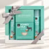 Coffret cadeau bien-être Bodyfarm au lait d’ânesse avec gel douche, lotion pour le corps et savon, dans une boîte avec ruban.