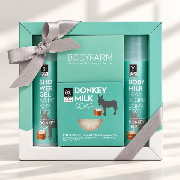 Coffret cadeau bien-être Bodyfarm au lait d’ânesse avec gel douche, lotion pour le corps et savon, dans une boîte avec ruban.
